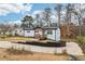 Beautifully renovated white brick home with a modern front porch and spacious driveway at 5901 Miller Rd, Austell, GA 30106