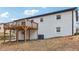 White two-story home featuring a wooden deck with black metal railings at 5901 Miller Rd, Austell, GA 30106