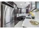 Well-equipped kitchen featuring stainless steel appliances, modern fixtures, and bright countertops at 5901 Miller Rd, Austell, GA 30106