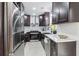 Well-equipped kitchen featuring stainless steel appliances, modern fixtures, and bright countertops at 5901 Miller Rd, Austell, GA 30106