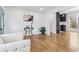 Open-concept living area with hardwood floors and seamless flow to the kitchen at 5901 Miller Rd, Austell, GA 30106