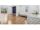 Spacious living room featuring hardwood floors, white sofas, and lots of natural light at 5901 Miller Rd, Austell, GA 30106