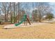A delightful community playground featuring a green slide and swing set at 5901 Miller Rd, Austell, GA 30106