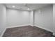 This bedroom features gray walls, dark wood floors, white trim, and a ceiling fan at 734 Olde Towne Ln, Marietta, GA 30068