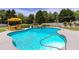Inviting backyard pool with waterfall feature, lounge chairs, and lush landscaping at 820 Nob Ridge Dr, Marietta, GA 30064