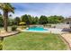 Inviting backyard pool with waterfall feature, lounge chairs, and lush landscaping at 820 Nob Ridge Dr, Marietta, GA 30064