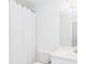 Bathroom featuring a shower with a white curtain, a white vanity, and a large mirror at 820 Nob Ridge Dr, Marietta, GA 30064