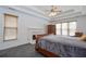 Bedroom featuring a tray ceiling, fireplace and natural light at 820 Nob Ridge Dr, Marietta, GA 30064