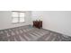 Bedroom featuring neutral carpet, base trim and natural light from the window at 820 Nob Ridge Dr, Marietta, GA 30064