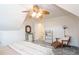Cozy bedroom featuring a ceiling fan, neutral walls, and a comfortable seating area with a wooden chair at 820 Nob Ridge Dr, Marietta, GA 30064