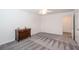 Bedroom features a wooden dresser, an outlet, carpet, and an open doorway at 820 Nob Ridge Dr, Marietta, GA 30064