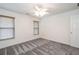 Bedroom with neutral walls, wood blinds, ceiling fan, and gray carpeting at 820 Nob Ridge Dr, Marietta, GA 30064