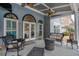 Relaxing covered patio showcasing a fire pit, ceiling fans, comfortable seating, and easy access to the pool area at 820 Nob Ridge Dr, Marietta, GA 30064