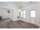 Well lit dining area with wood floors, pendant lighting, and access to the backyard at 820 Nob Ridge Dr, Marietta, GA 30064
