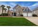 Charming two-story home featuring stone accents, a two-car garage, and a lush green lawn at 820 Nob Ridge Dr, Marietta, GA 30064
