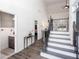 Elegant foyer with staircase, hardwood floors, and access to a half bathroom at 820 Nob Ridge Dr, Marietta, GA 30064