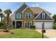 Charming two-story home with stone and siding, manicured lawn, and a two-car garage at 820 Nob Ridge Dr, Marietta, GA 30064