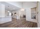 Bright, open-concept kitchen with white cabinetry, stainless steel appliances and gray wood flooring at 820 Nob Ridge Dr, Marietta, GA 30064