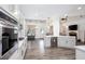 Open kitchen featuring stainless steel appliances, hardwood flooring and granite countertops at 820 Nob Ridge Dr, Marietta, GA 30064