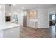 Bright kitchen featuring stainless steel appliances, white cabinets, and light-colored hardwood floors at 820 Nob Ridge Dr, Marietta, GA 30064