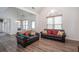 Spacious living room featuring wood flooring, high ceilings, and multiple seating arrangements at 820 Nob Ridge Dr, Marietta, GA 30064