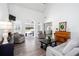 Bright and airy living room with high ceilings, hardwood floors, and access to the outdoor pool at 820 Nob Ridge Dr, Marietta, GA 30064