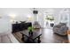 Bright living room showcasing hardwood floors, modern furniture, and seamless access to the outdoor pool at 820 Nob Ridge Dr, Marietta, GA 30064