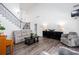 Open concept living room featuring neutral paint, dark accents, lots of light, and a piano at 820 Nob Ridge Dr, Marietta, GA 30064