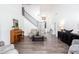 Spacious living room featuring piano, hardwood floors, neutral palette, and staircase at 820 Nob Ridge Dr, Marietta, GA 30064