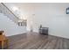 Living room featuring wood floors, staircase, and a tall ceiling at 820 Nob Ridge Dr, Marietta, GA 30064