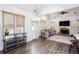 Open living room featuring wood floors, natural light, modern lighting, a fireplace, and vaulted ceilings at 820 Nob Ridge Dr, Marietta, GA 30064