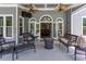 Covered patio with stylish seating, a fire pit, and views of the backyard at 820 Nob Ridge Dr, Marietta, GA 30064