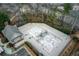 Aerial view of an empty community pool undergoing maintenance, surrounded by trees and a pool house at 820 Nob Ridge Dr, Marietta, GA 30064