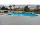 Sparkling swimming pool featuring a stone waterfall, lounge chairs, and umbrella for enjoying sunny days in style at 820 Nob Ridge Dr, Marietta, GA 30064
