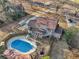 Aerial view of property featuring a pool, deck, backyard, and mature trees at 130 Thornton Dr, Fayetteville, GA 30214