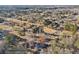 Aerial view showing a home, its surrounding neighborhood, and wooded areas at 130 Thornton Dr, Fayetteville, GA 30214