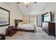 Bright main bedroom with large windows, ceiling fan, and ensuite bathroom at 130 Thornton Dr, Fayetteville, GA 30214