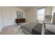 Bright bedroom with neutral tones, modern dresser, and plenty of natural light at 146 Silverton Dr, Dacula, GA 30019