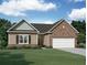 Charming single-story home featuring a brick facade, a two-car garage, and a well-manicured lawn at 146 Silverton Dr, Dacula, GA 30019