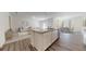Open-concept kitchen with a large island, sleek appliances, and seamless flow to living areas at 146 Silverton Dr, Dacula, GA 30019