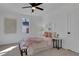 Charming bedroom with soft lighting, a comfortable bed, and a view through the window at 1576 Elixir Sw Ave, Atlanta, GA 30314
