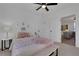 Stylish bedroom with a pink theme, a cozy bed, and bright lighting, perfect for relaxation at 1576 Elixir Sw Ave, Atlanta, GA 30314