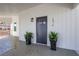 Covered front porch with plants and a stylish front door to welcome you home at 1576 Elixir Sw Ave, Atlanta, GA 30314