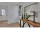 Inviting entryway featuring a wooden console table, decorative mirror, and ample natural light at 1576 Elixir Sw Ave, Atlanta, GA 30314