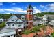 Stunning aerial view of Vinings Jubilee with its distinctive clock tower and vibrant surroundings at 2400 Cumberland Se Pkwy # 212, Atlanta, GA 30339