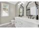 Charming bathroom with double vanities, attractive mirrors, and a window at 2400 Cumberland Se Pkwy # 212, Atlanta, GA 30339