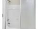 Bathroom features a white tub with shower and a sliding door at 2400 Cumberland Se Pkwy # 212, Atlanta, GA 30339