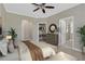 Comfortable bedroom with a large bed, closet, ceiling fan, and carpeted floors at 2400 Cumberland Se Pkwy # 212, Atlanta, GA 30339