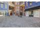 Cobblestone courtyard with benches outside of commercial buildings at 2400 Cumberland Se Pkwy # 212, Atlanta, GA 30339