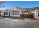 Street view of a commercial building with outdoor seating and ample parking at 2400 Cumberland Se Pkwy # 212, Atlanta, GA 30339
